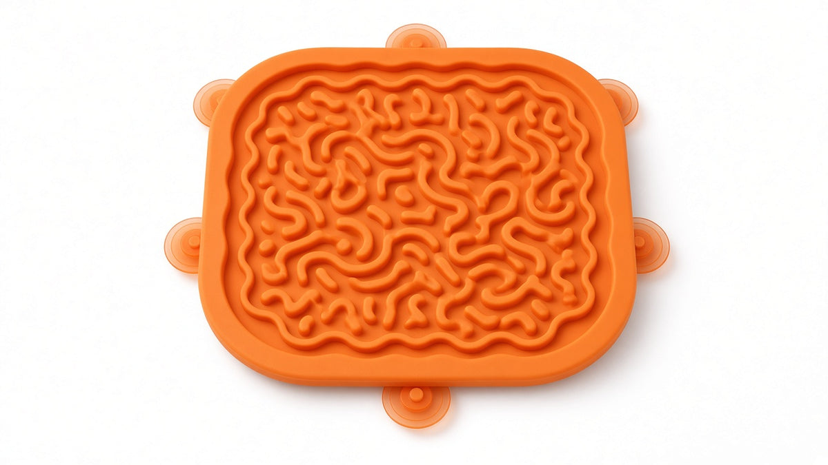 Studio product hero: silicone lick mat with suction cups on white